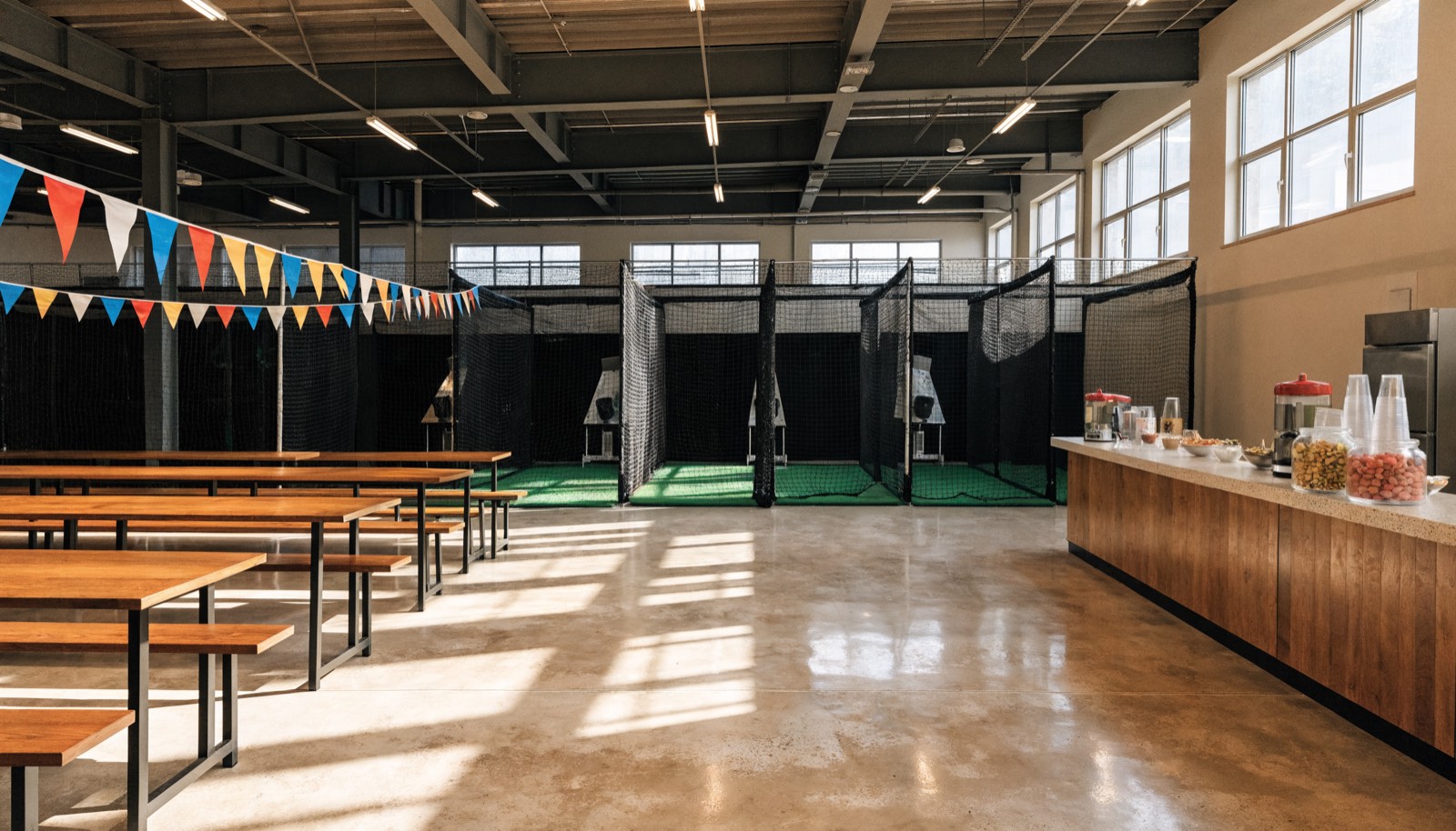 Party tables beside the batting cages